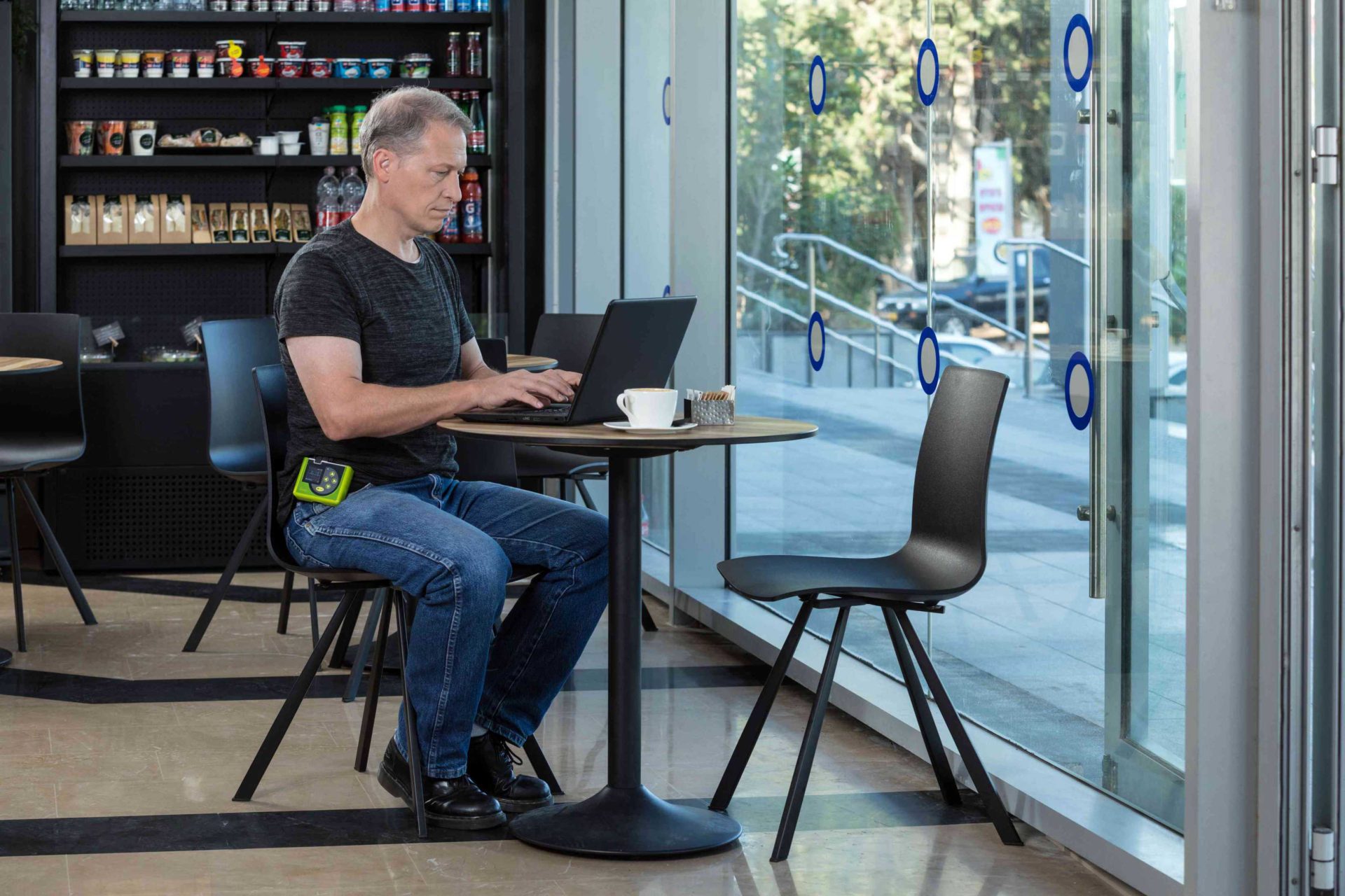 Man using a laptop for Wireless ECG Monitoring